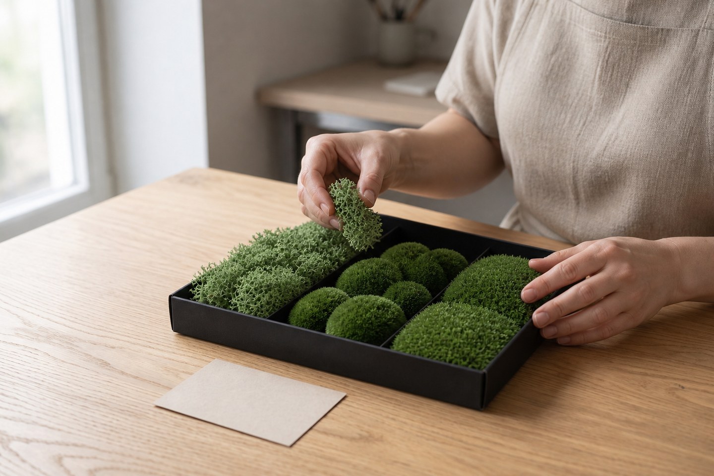 Sorting preserved moss by hand
